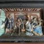 Figuralna scena w części centralnej kominka, przedstawiającą scenę zerwania Marcina Lutra z Rzymem